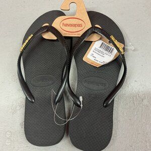 NWT Havaianas Slim Black/Golden Flip Flops w/Metallic Pop-Up Logo on Strap 7-8